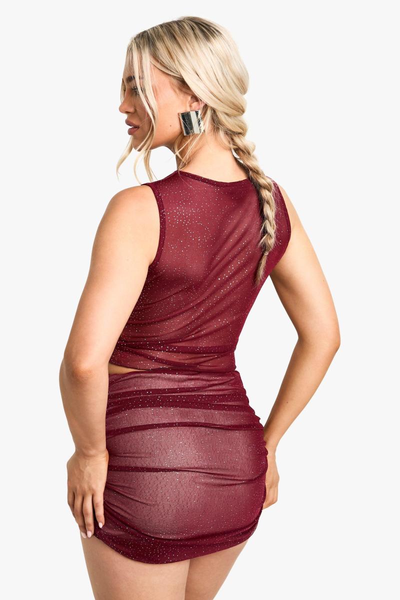 Міні-спідниця з блискучою сіткою і рюшами