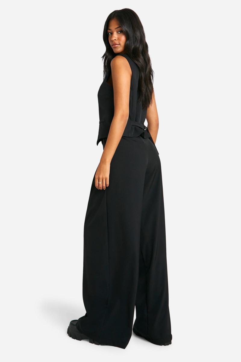 Широкі брюки з високими складками