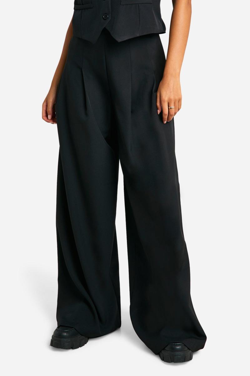 Широкі брюки з високими складками